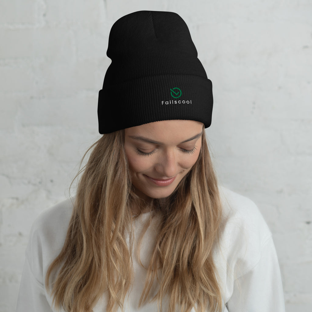 Female model wearing black Failscool cuffed beanie with white “THE ORIGINAL by Failscool” embroidery. A clean, confident look for cold weather and creative minds.