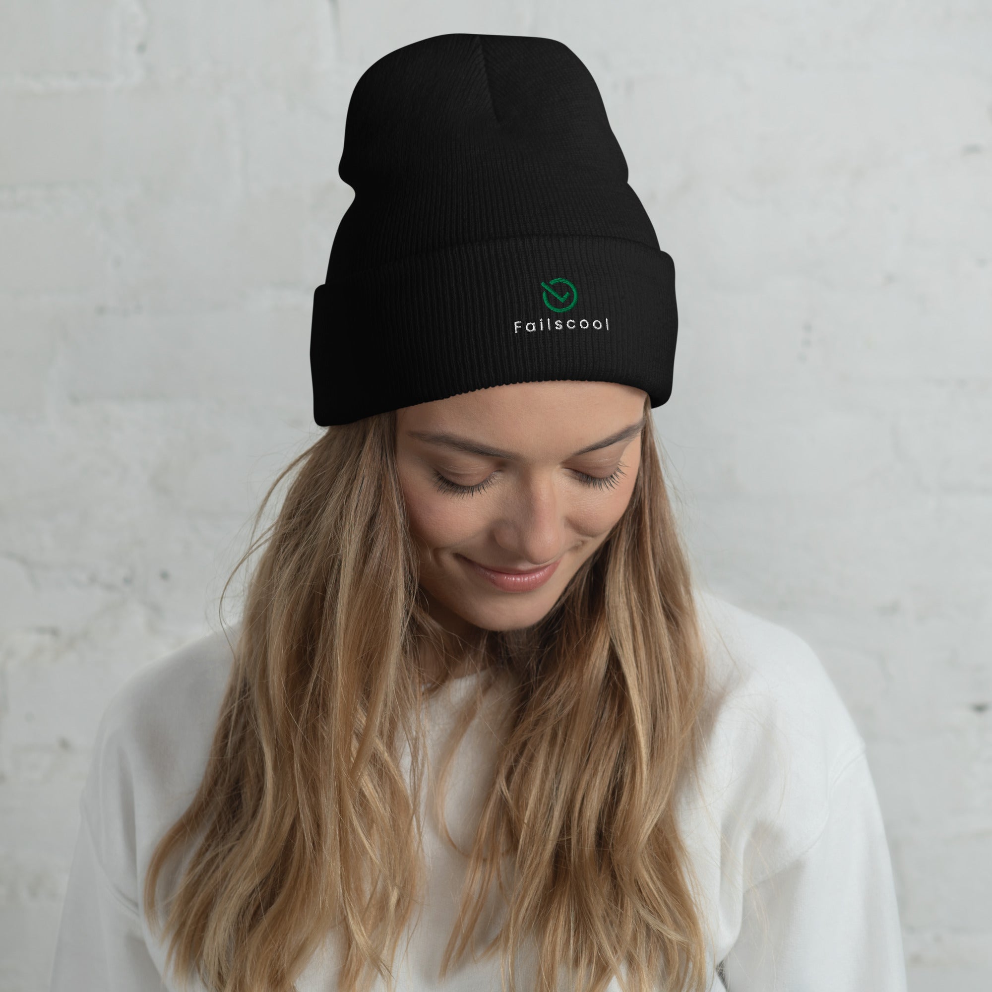 Female model wearing black Failscool cuffed beanie with white “THE ORIGINAL by Failscool” embroidery. A clean, confident look for cold weather and creative minds.
