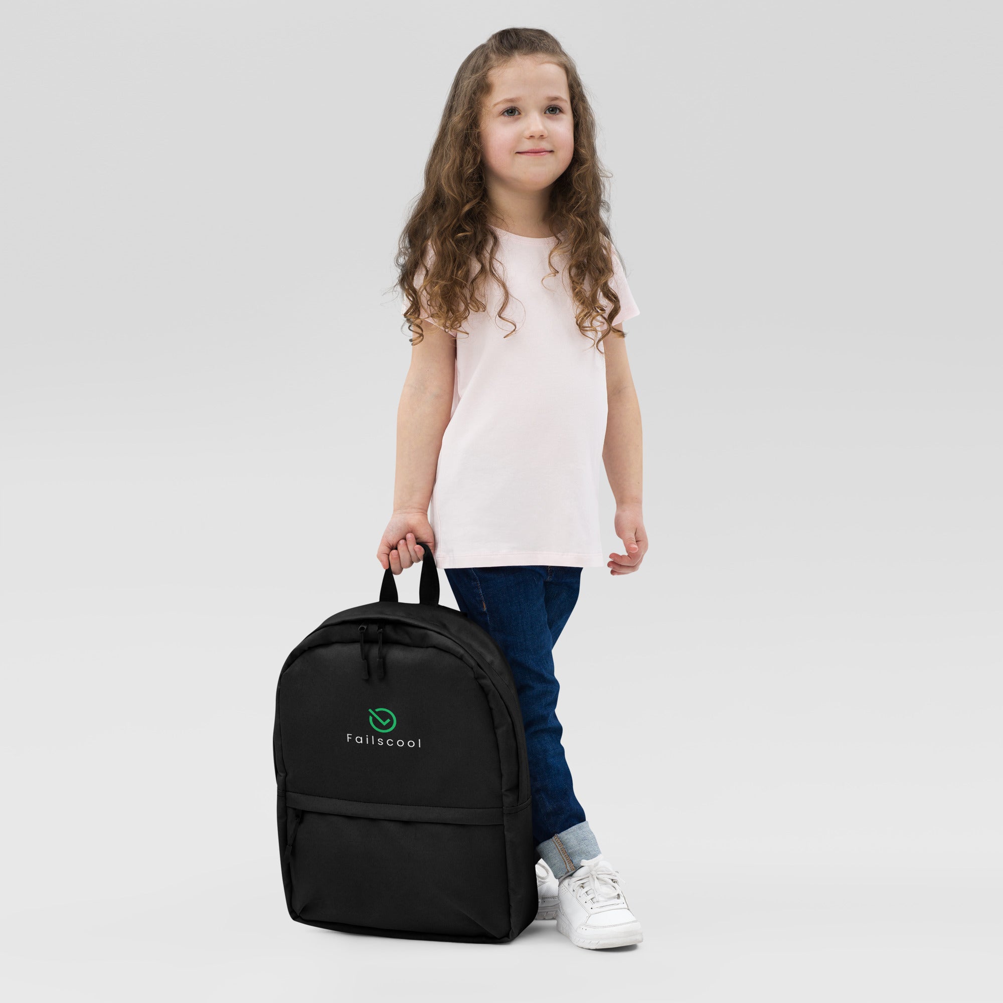 Front view of an 8-10-year-old girl wearing the Failscool Everyday Laptop Backpack. Youthful energy meets practical style for school and adventure.