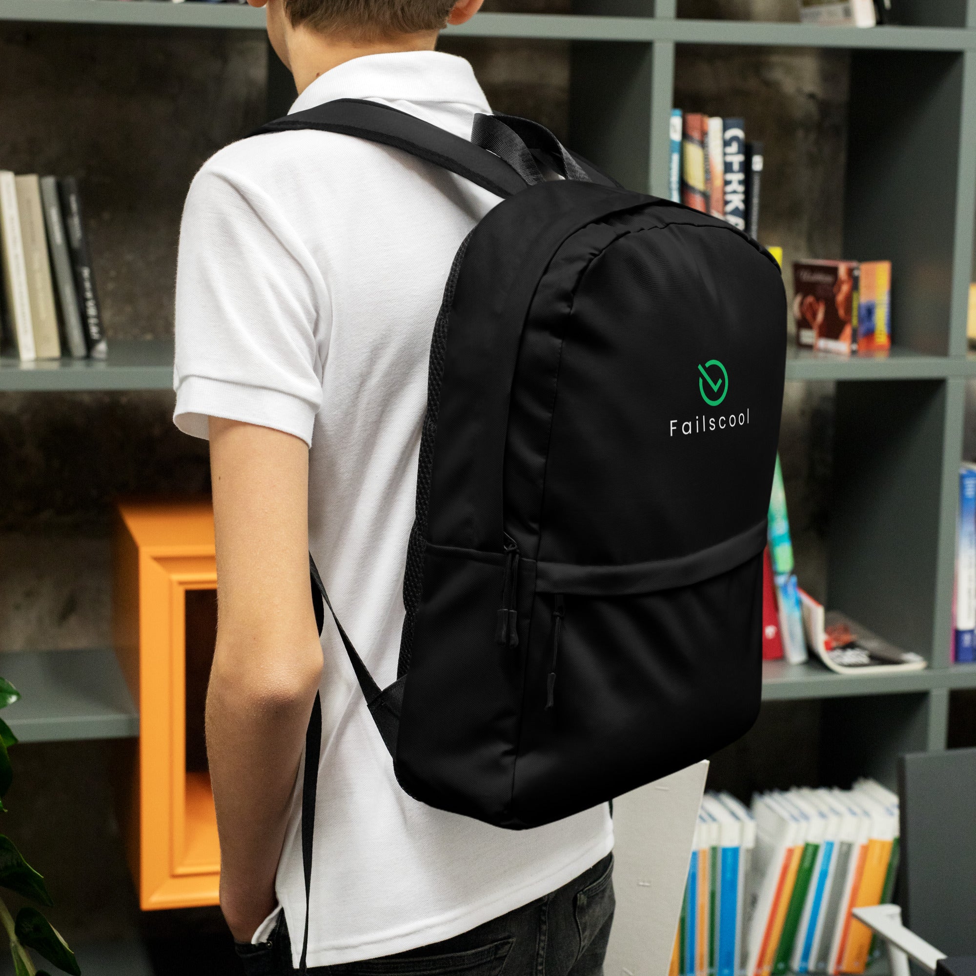 Teen boy wearing the black Failscool Everyday Laptop Backpack, captured from behind, symbolizing readiness, curiosity, and independent learning.