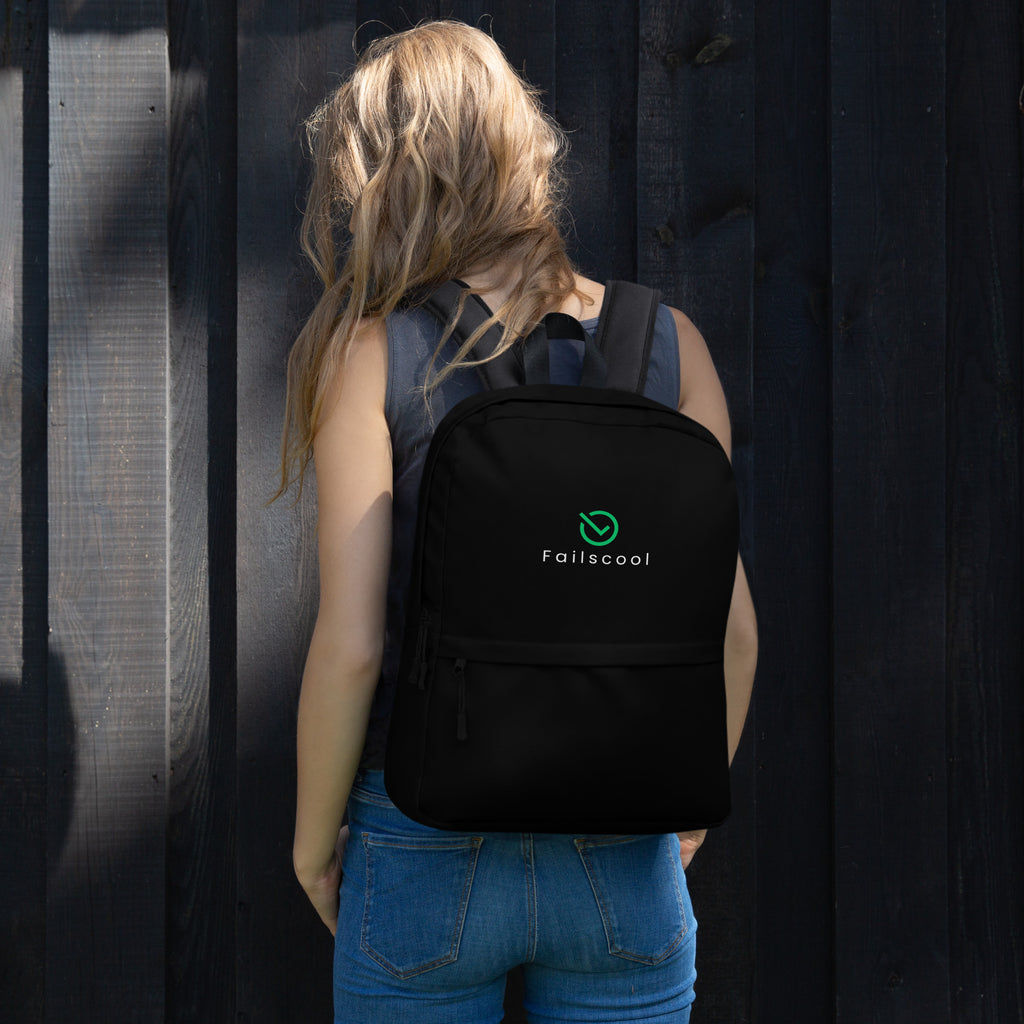 Teen girl wearing the Failscool Everyday Laptop Backpack in black, seen from behind. A symbol of confidence, growth, and creativity in motion.