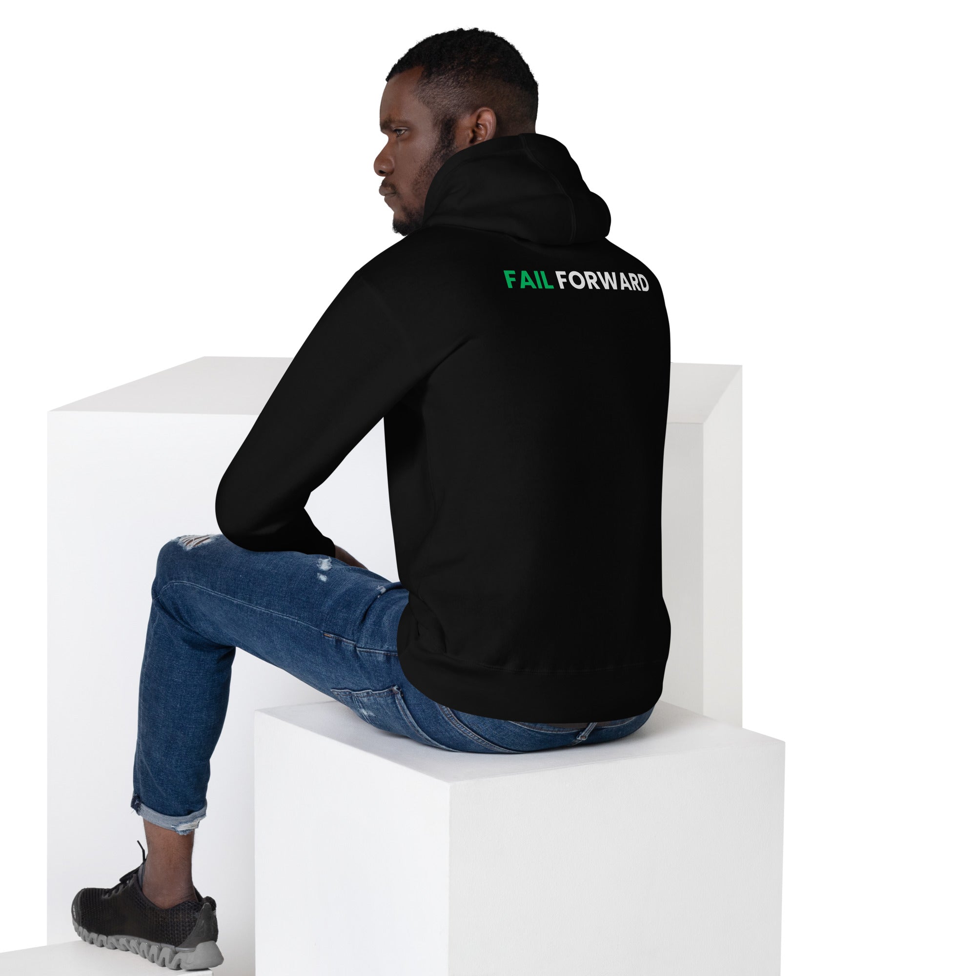 Back view of male model in the black Failscool hoodie. Soft cotton blend and clean fit representing resilience and purpose.