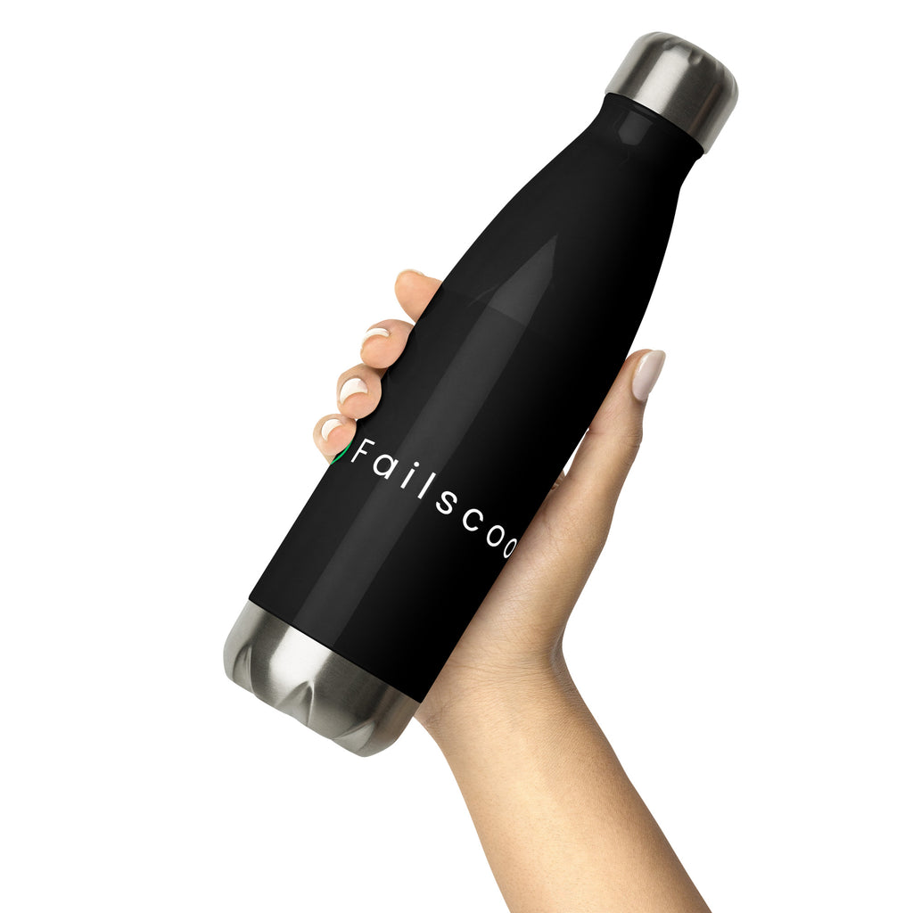 Hand holding a black Failscool stainless steel bottle with white “THE ORIGINAL” logo. Symbol of simplicity, purpose, and conscious lifestyle.