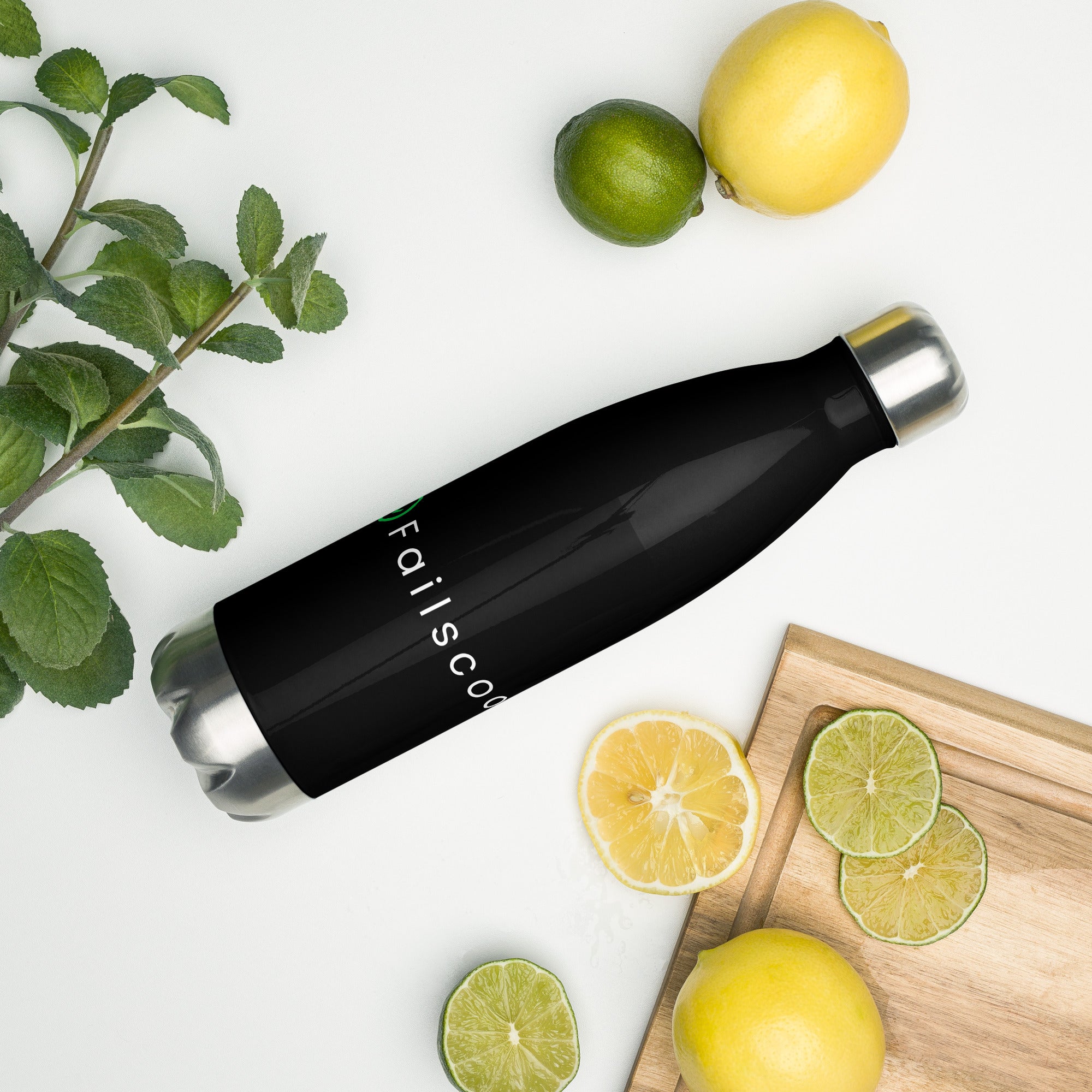 Failscool stainless steel bottle surrounded by fresh lemons. Sleek matte black finish and white logo symbolizing energy, freshness, and mindful living.