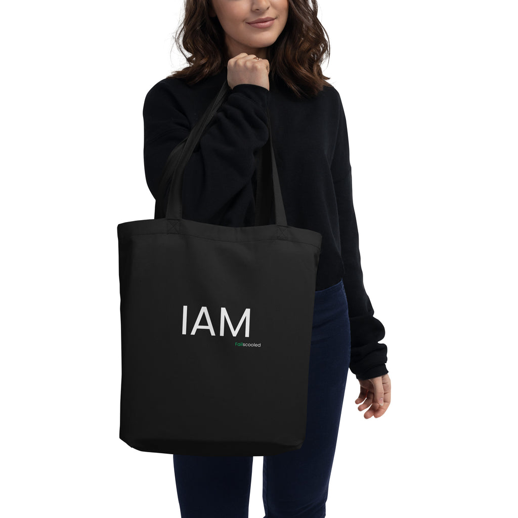 Front view of the black Failscool eco tote bag with white “I AM FAILSCOOLED” print. Minimalist recycled design promoting authenticity, creativity, and the courage to grow.