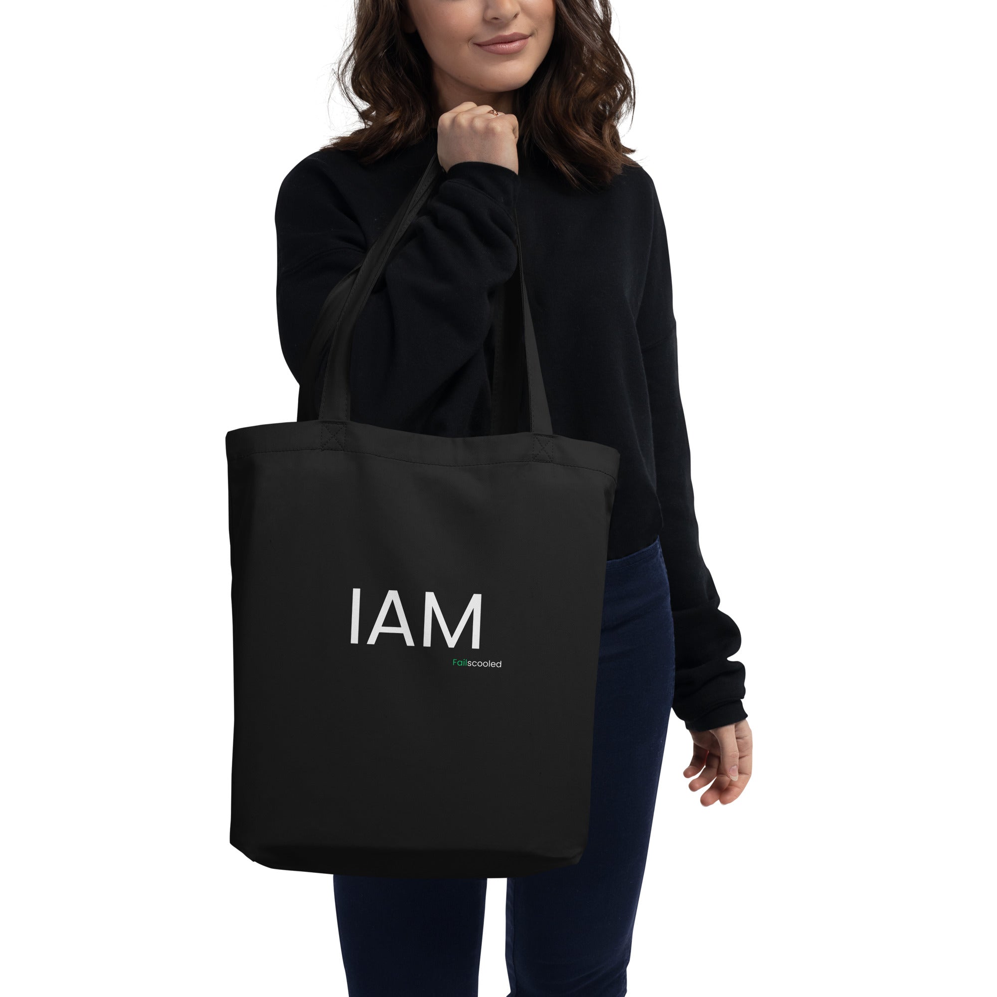 Front view of the black Failscool eco tote bag with white “I AM FAILSCOOLED” print. Minimalist recycled design promoting authenticity, creativity, and the courage to grow.